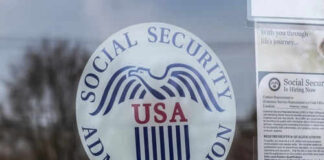 Social Security Administration USA logo on glass door.