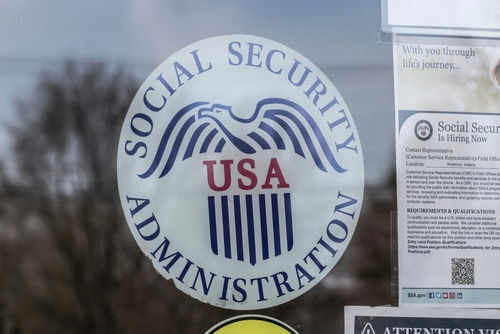 Social Security Administration USA logo on glass door.