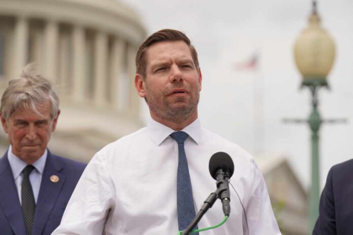 Eric Swalwell_2184093151.jpg A politician speaking at a press conference outside the Capitol building
