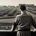 CHILLING: Historian Faces Prison For Social Media Post A historical figure overlooking a large military gathering