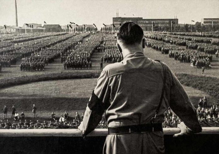 shutterstock_2643319025.jpg A historical figure overlooking a large military gathering
