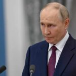 White House Shrugs Off Russia-Iran Intel Swap A serious-looking man in a suit during a press conference
