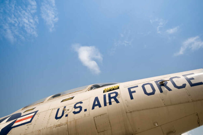 Close-up view of a U.S. Air Force aircraft against a blue sky