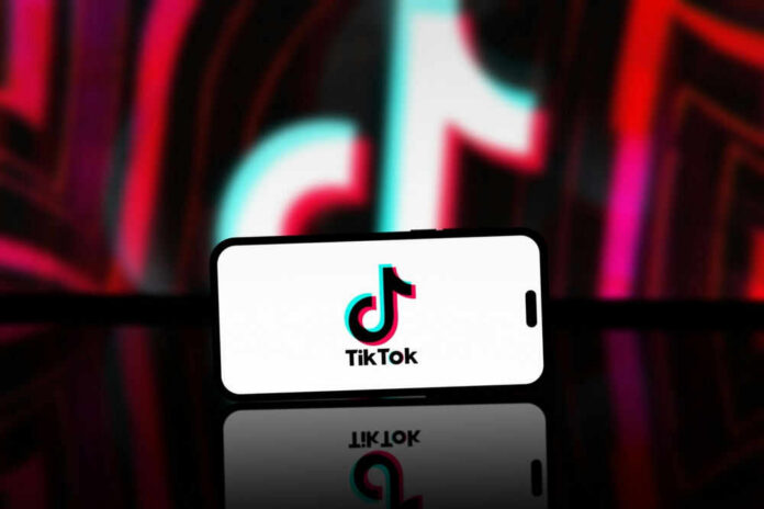 tiktokid2449600225jpg tiktok logo on mobile phone