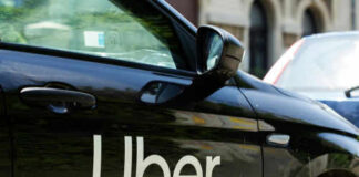 Black car with Uber logo on side door