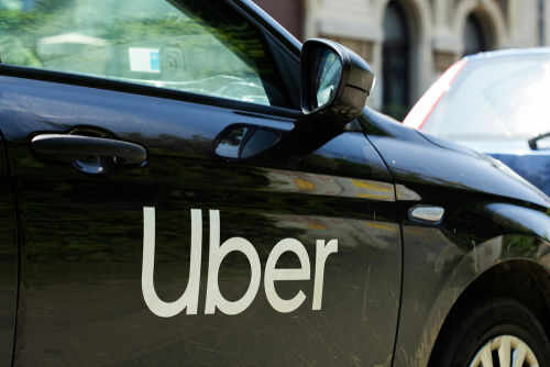 uber1405705382 Black car with Uber logo on side door