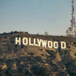 Disney Star HELD Intruder at Gunpoint—Wild Footage Hollywood sign with communication tower on hillside.