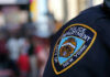 NYC Mayor SLASHES 5,000 Cops For This NYPD officer uniform badge closeup in NYC