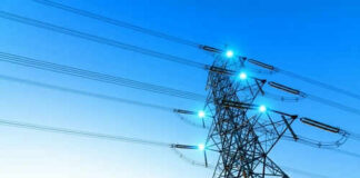 Electricity pylon with blue sky background