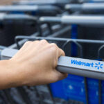 Deranged Woman SLASHES Toddler’s Face — Police FIRE! Hand gripping a Walmart shopping cart handle