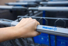 Deranged Woman SLASHES Toddler’s Face — Police FIRE! Hand gripping a Walmart shopping cart handle