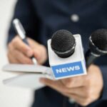 250-Pound Attacker SHOCKS: Reporter Slammed to Ground A journalist holding a notebook and microphones labeled 'NEWS'