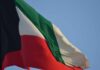 Iran SHATTERS Ceasefire — Kuwait Oil Attacked Kuwait national flag waving in the wind