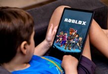 Child playing Roblox on a tablet