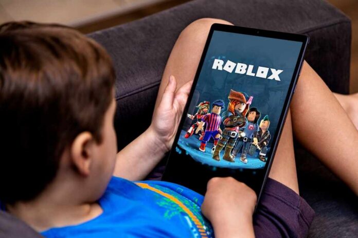 Child playing Roblox on a tablet