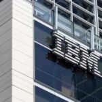 IBM PAYS $17M — DEI Crackdown BEGINS Close-up of the IBM logo on a modern corporate building