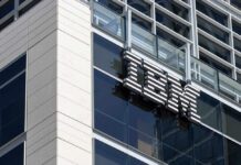 Close-up of the IBM logo on a modern corporate building