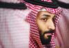 Close-up portrait of a man in traditional Saudi attire