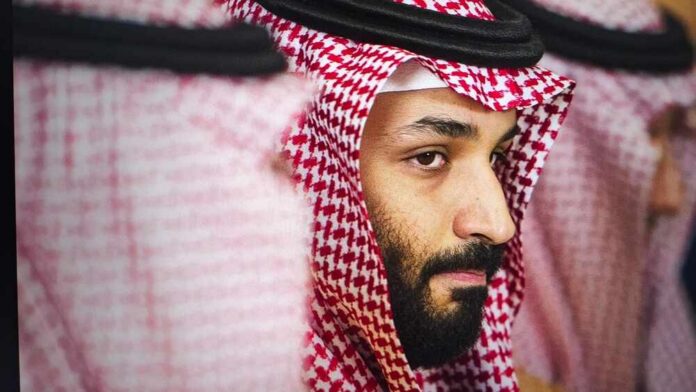 Close-up portrait of a man in traditional Saudi attire