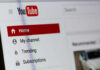 Close-up of YouTube homepage navigation menu.