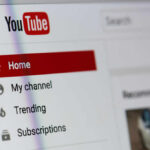 YouTube’s AI Tool Hijacks Creators—Shock! Close-up of YouTube homepage navigation menu.