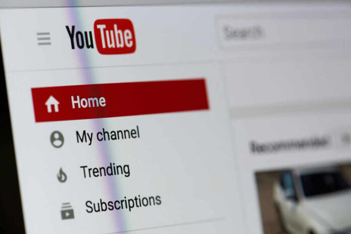 Close-up of YouTube homepage navigation menu.