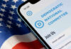 DNC’s Autopsy Bombshell – Leaders in Panic Mode! Phone screen displaying Democratic National Committee website.