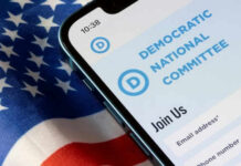 DNC’s Autopsy Bombshell – Leaders in Panic Mode! Phone screen displaying Democratic National Committee website.