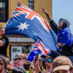 Crowd with Australian flags at an outdoor gathering