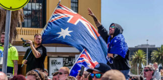 Crowd with Australian flags at an outdoor gathering