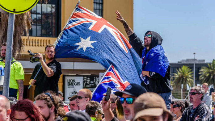 Crowd with Australian flags at an outdoor gathering