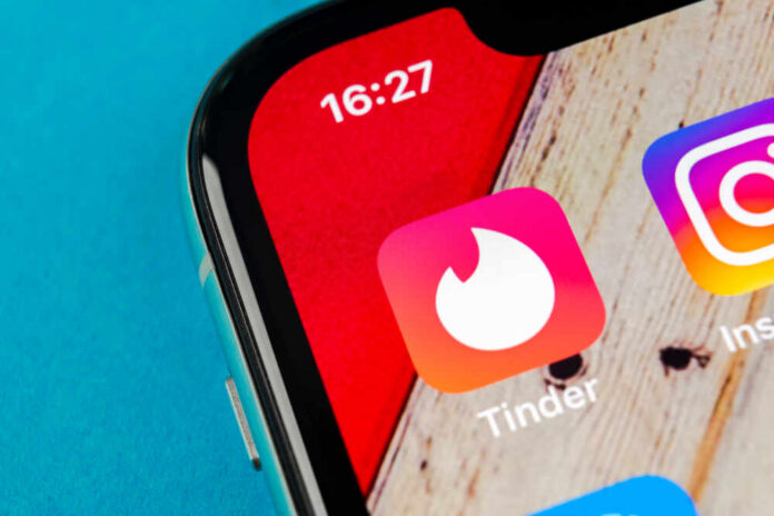 shutterstock_1184833246.jpg Close-up of a smartphone screen displaying Tinder and Instagram app icons
