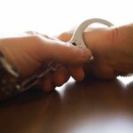SHOCK Arrest: Embryos in ‘Life Parcel’ Close-up of a handcuff being secured on a wrist