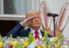 Iran Deal Draft: Can Trump Achieve the Unthinkable? A man in a suit saluting in front of a floral display during an Easter event