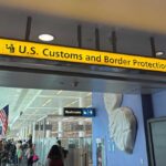 Mullin Warns Sanctuary Cities: Cooperate or Face Customs Cuts Sign for U.S. Customs and Border Protection at an airport