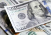 Several US one hundred dollar bills