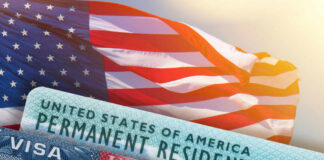 U.S. flag with visa and permanent resident card in foreground