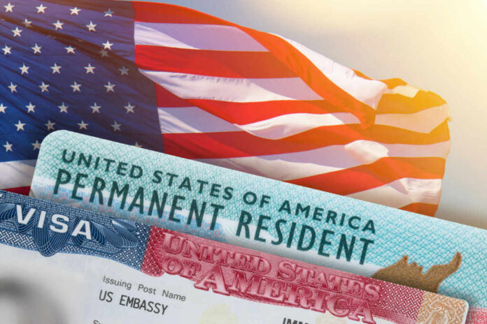 visa-united-states-of-america1834985749jpg U.S. flag with visa and permanent resident card in foreground