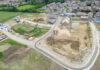 Obama Center Money Meltdown Aerial view of a housing construction site beside a residential neighborhood