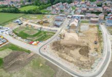 Obama Center Money Meltdown Aerial view of a housing construction site beside a residential neighborhood