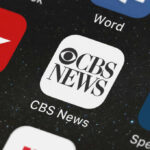 Legacy News Crack-Up: Who’s Gutting 60 Minutes? CBS News app icon on smartphone screen