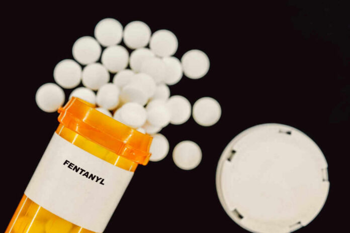 fentanyl-rx-medical-pills2308656951jpg Prescription bottle of fentanyl tablets scattered on surface