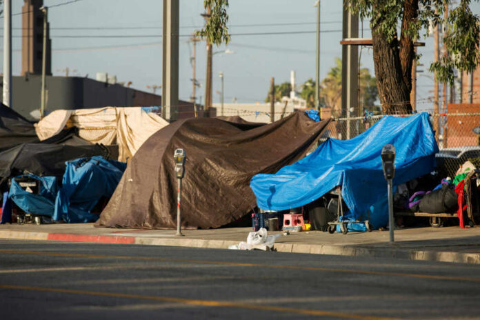 homelesscampsid1495413719jpg Street encampment with tarps and makeshift shelters