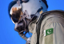 Pakistan’s Deadly Mi-17 Crash—What Authorities Aren’t Saying Close-up of a military pilot wearing a helmet and a uniform with a Pakistan flag patch