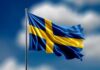 Open Borders Myth Shattered In Sweden Waving flag of Sweden against a blue sky