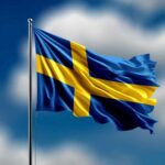 Open Borders Myth Shattered In Sweden Waving flag of Sweden against a blue sky