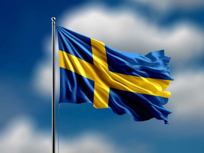 Sweden,Flag,Flying,On,Blur,Blue,Clouds,Background. Waving flag of Sweden against a blue sky
