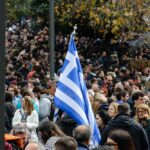 Greece Fast-Tracks Deportations — Courts Bristle Two Greek passports on Greek flag background