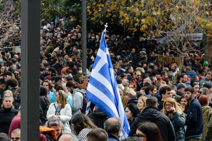 Athens,,Greece,-,February,28,,2025:,The,Huge,Demonstration,For Two Greek passports on Greek flag background