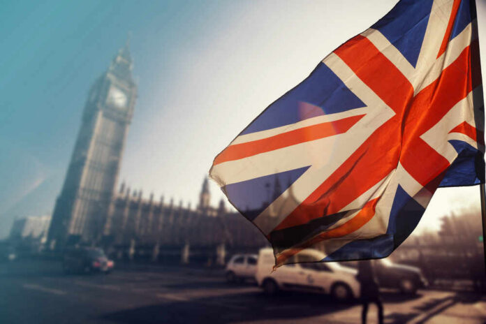 Uk,Flag,With,Big,Ben,And,House,Of,Parliament,In Union Jack flag in front of Big Ben in London